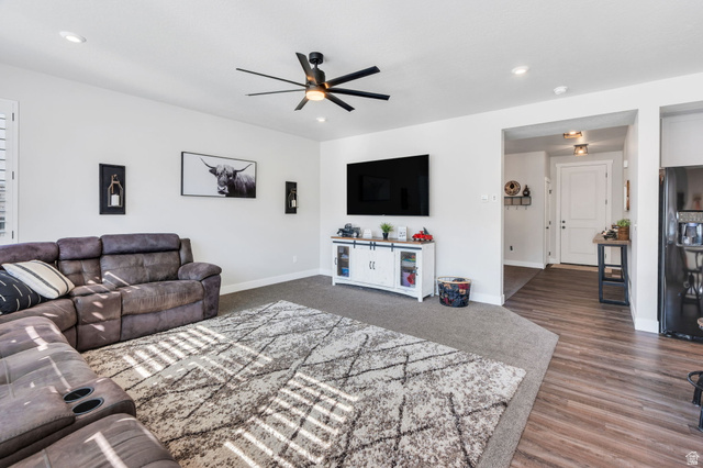 252 North Sunrise Rnch Drive Mapleton, UT 84664 - Photo 14 of 62 Spacious living area featuring light-toned walls, recessed lighting, and a dark-bladed ceiling fan