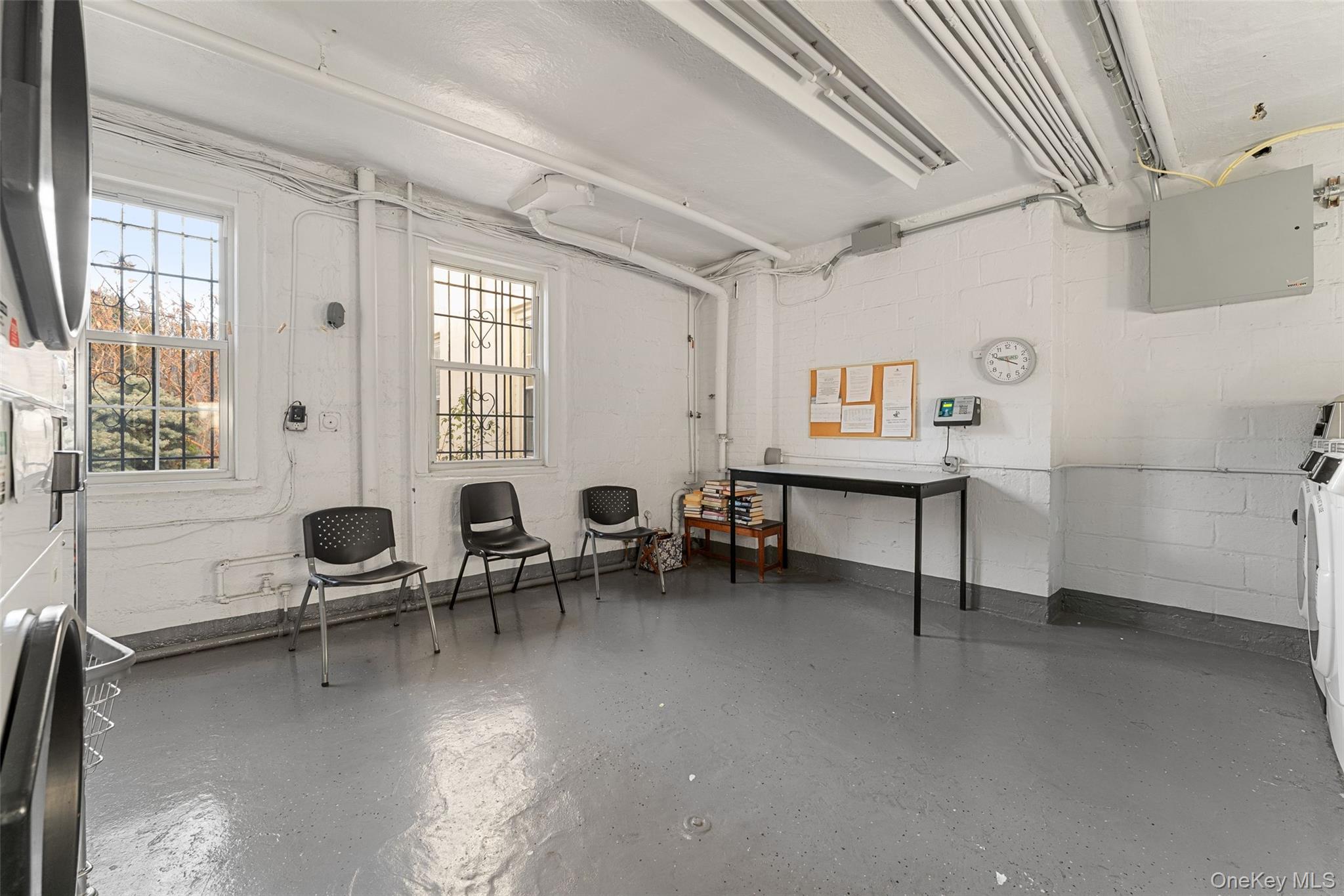11 Brooklands, Unit GI Bronxville, NY 10708 - Photo 14 of 16 a living room with furniture and a large window