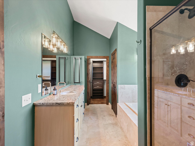 1225 Old Oregon Road Soda Springs, ID 83276 - Photo 36 of 67 Spacious bathroom featuring a double vanity with granite-style countertop, integrated sinks, and contemporary lighting