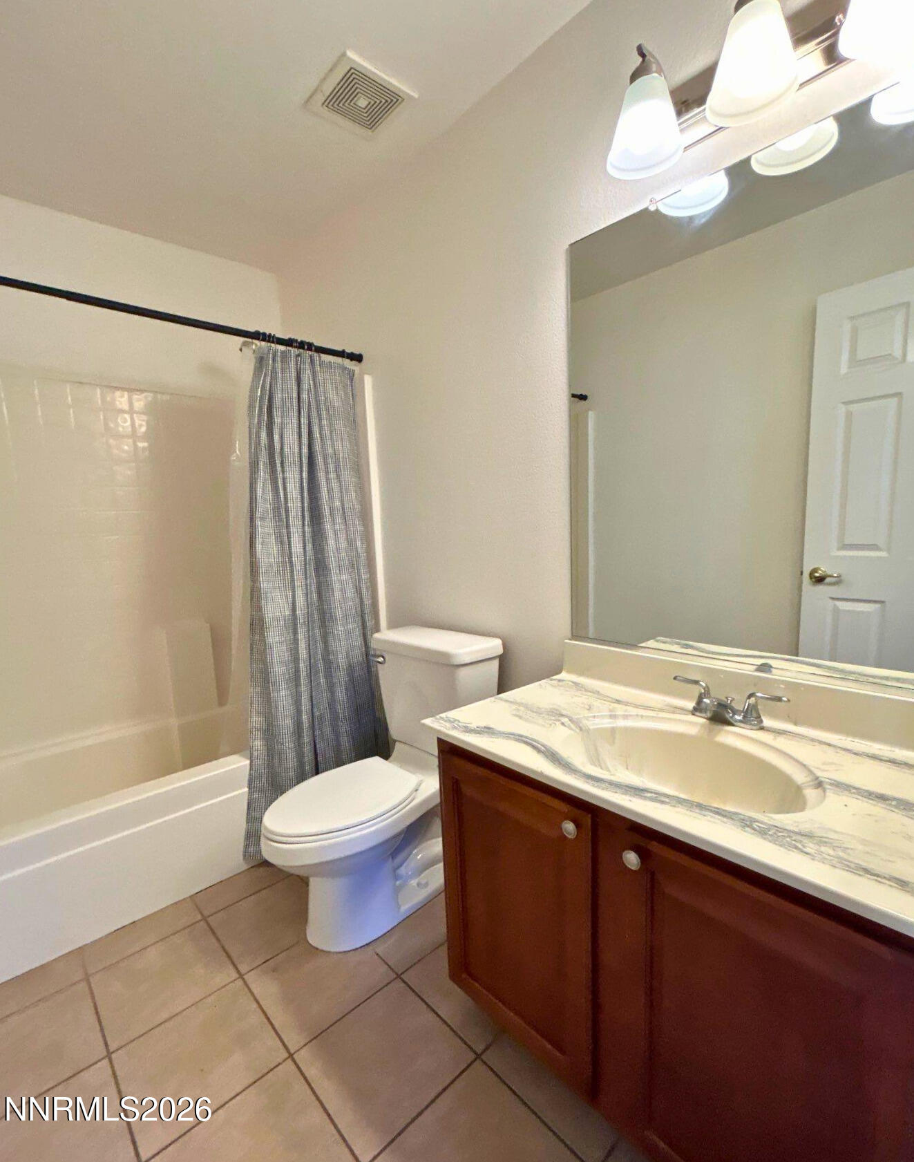 7614 Corso Street Reno, NV 89506 - Photo 13 of 15 a bathroom with a sink toilet and shower