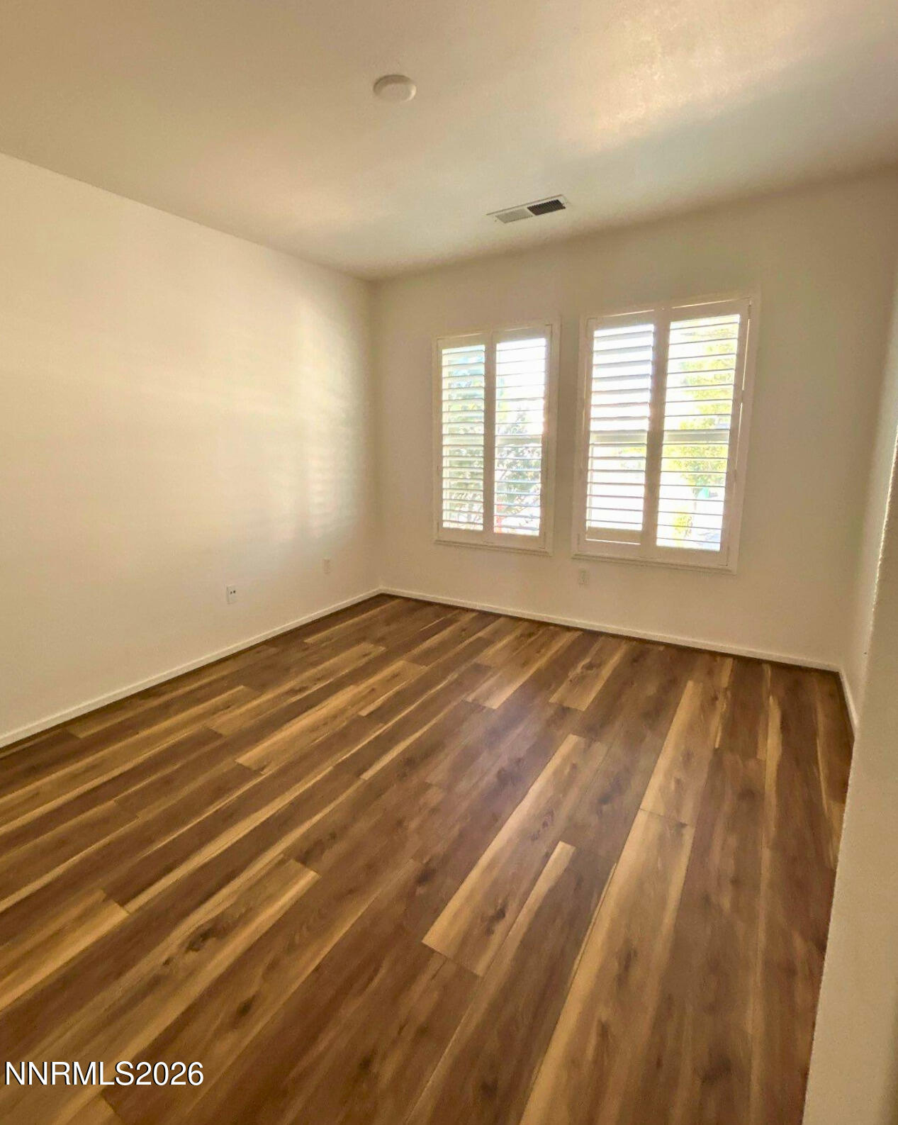 7614 Corso Street Reno, NV 89506 - Photo 3 of 15 a view of an empty room with a window