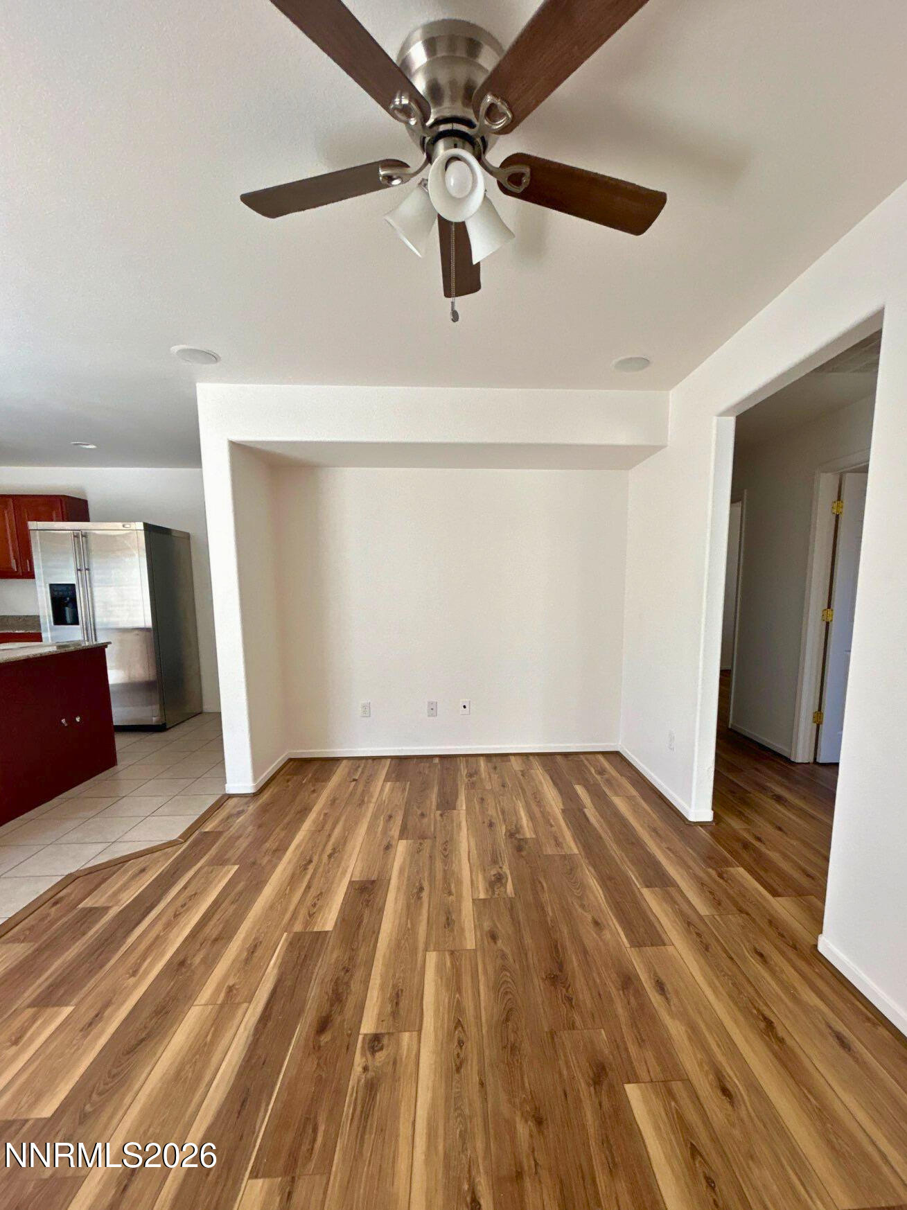 7614 Corso Street Reno, NV 89506 - Photo 7 of 15 a view of an empty room with wooden floor