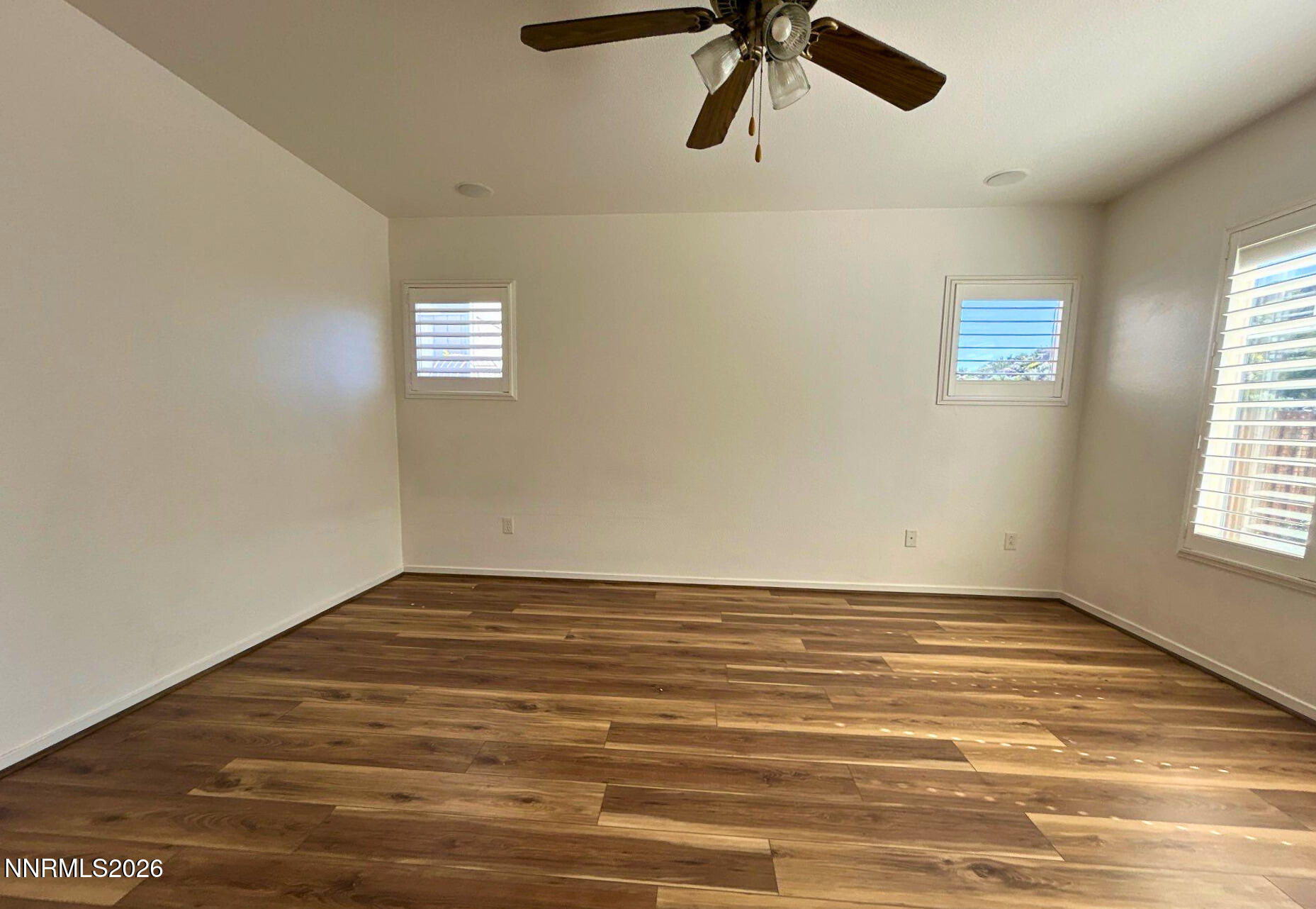 7614 Corso Street Reno, NV 89506 - Photo 8 of 15 a view of a room with a window and hardwood floor