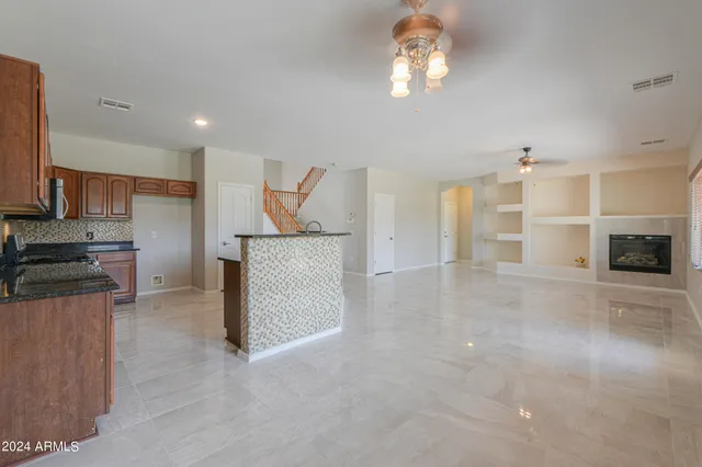 a view of a kitchen with a stove cabinets and a kitchen