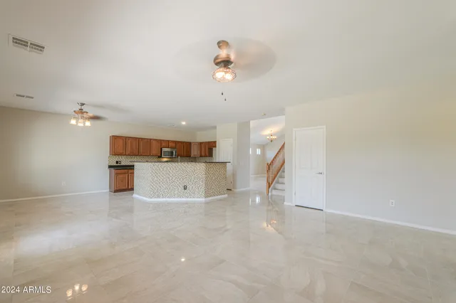 a view of a kitchen with a sink and cabinets