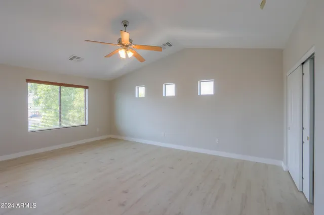 a view of an empty room with a window