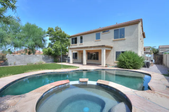 a view of a house with swimming pool