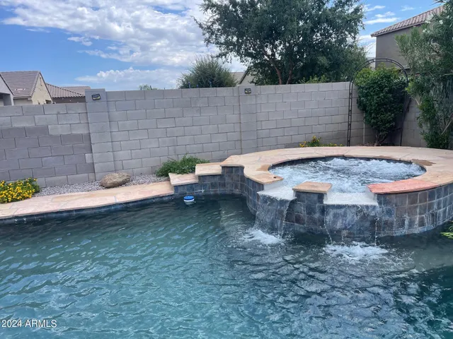 a view of a backyard with sitting area