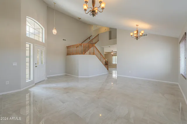 a view of a livingroom with stairs