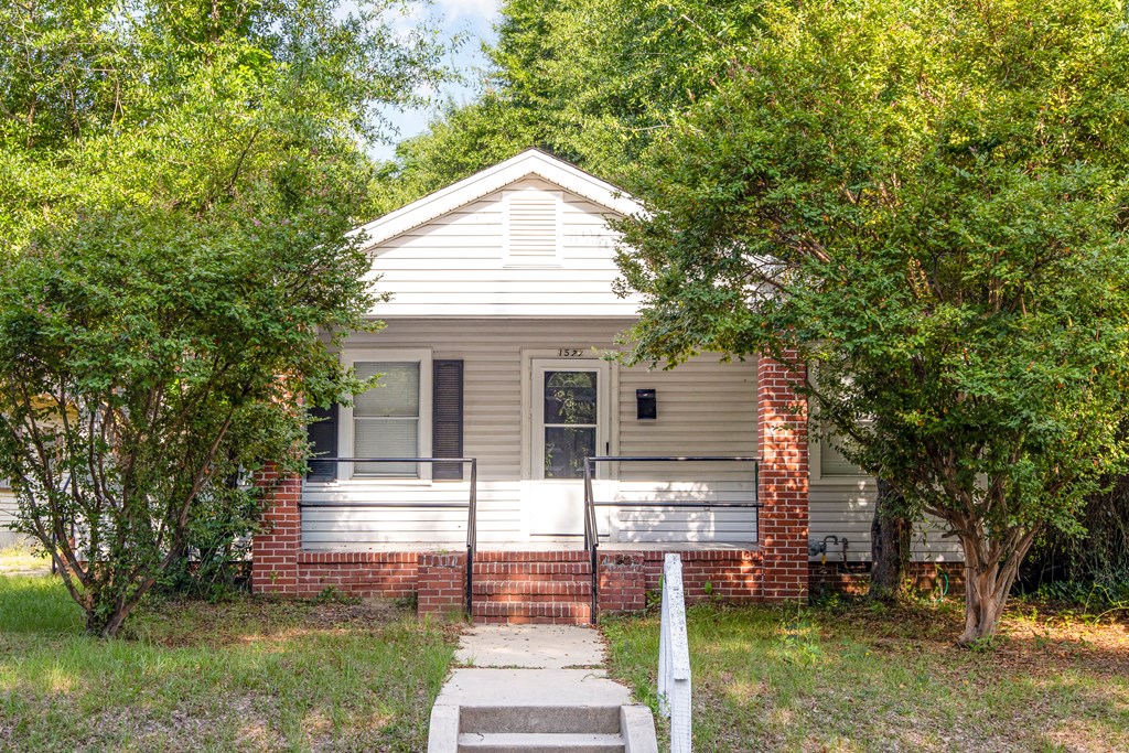 108 Comer Street Columbus, GA 31904 - Photo 7 of 11 a front view of a house with a yard