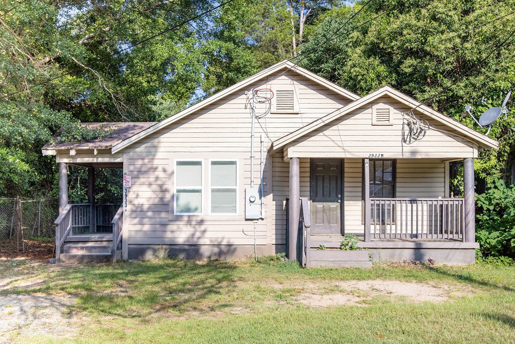 108 Comer Street Columbus, GA 31904 - Photo 10 of 11 a view of a house with a small yard plants and large tree