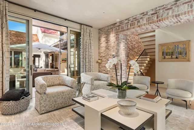 a bedroom with a bed and a television