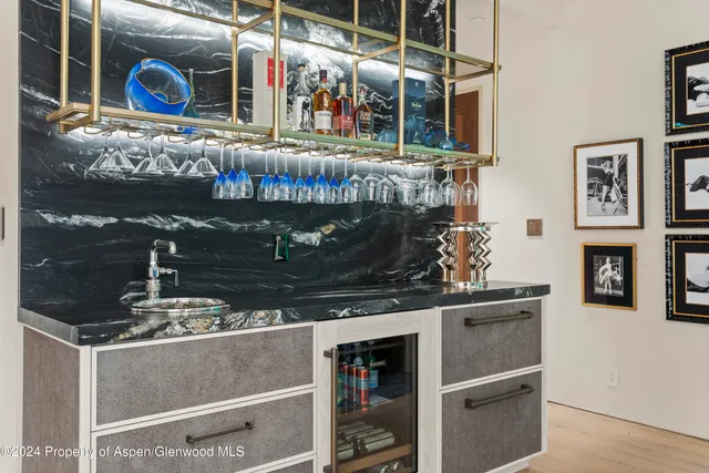 a utility room with sink dryer and washer