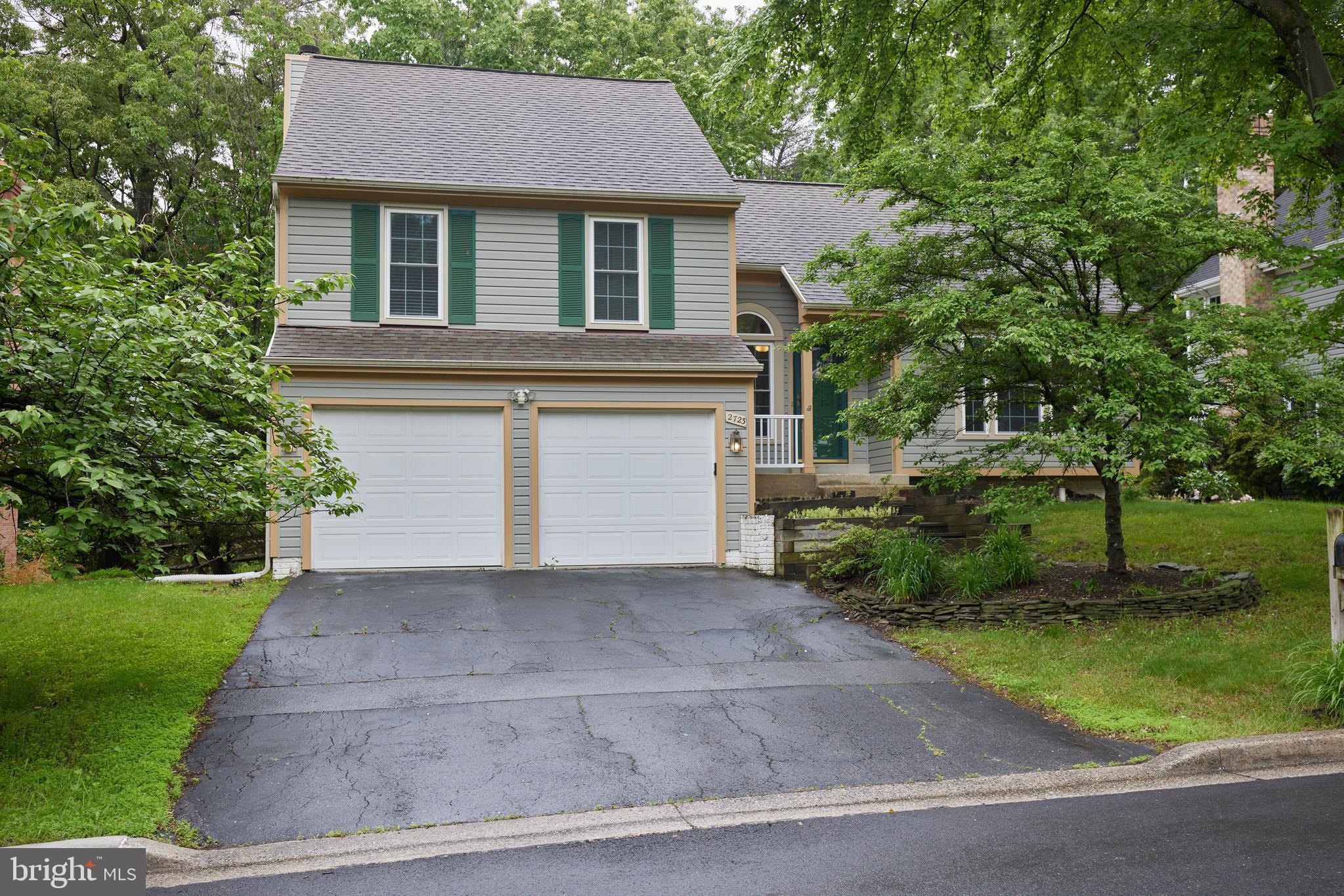 2723 Deer Ridge Drive Silver Spring, MD 20904 - Photo 1 of 45 a front view of a house with a yard and garage
