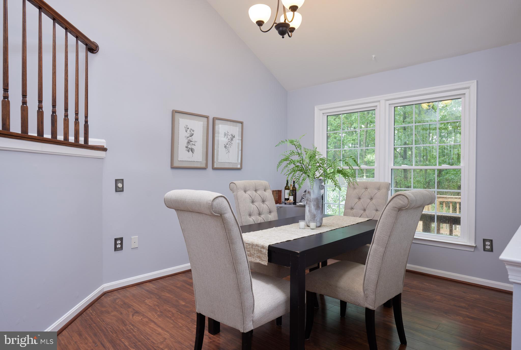 2723 Deer Ridge Drive Silver Spring, MD 20904 - Photo 11 of 45 a dining room with furniture potted plants and wooden floor
