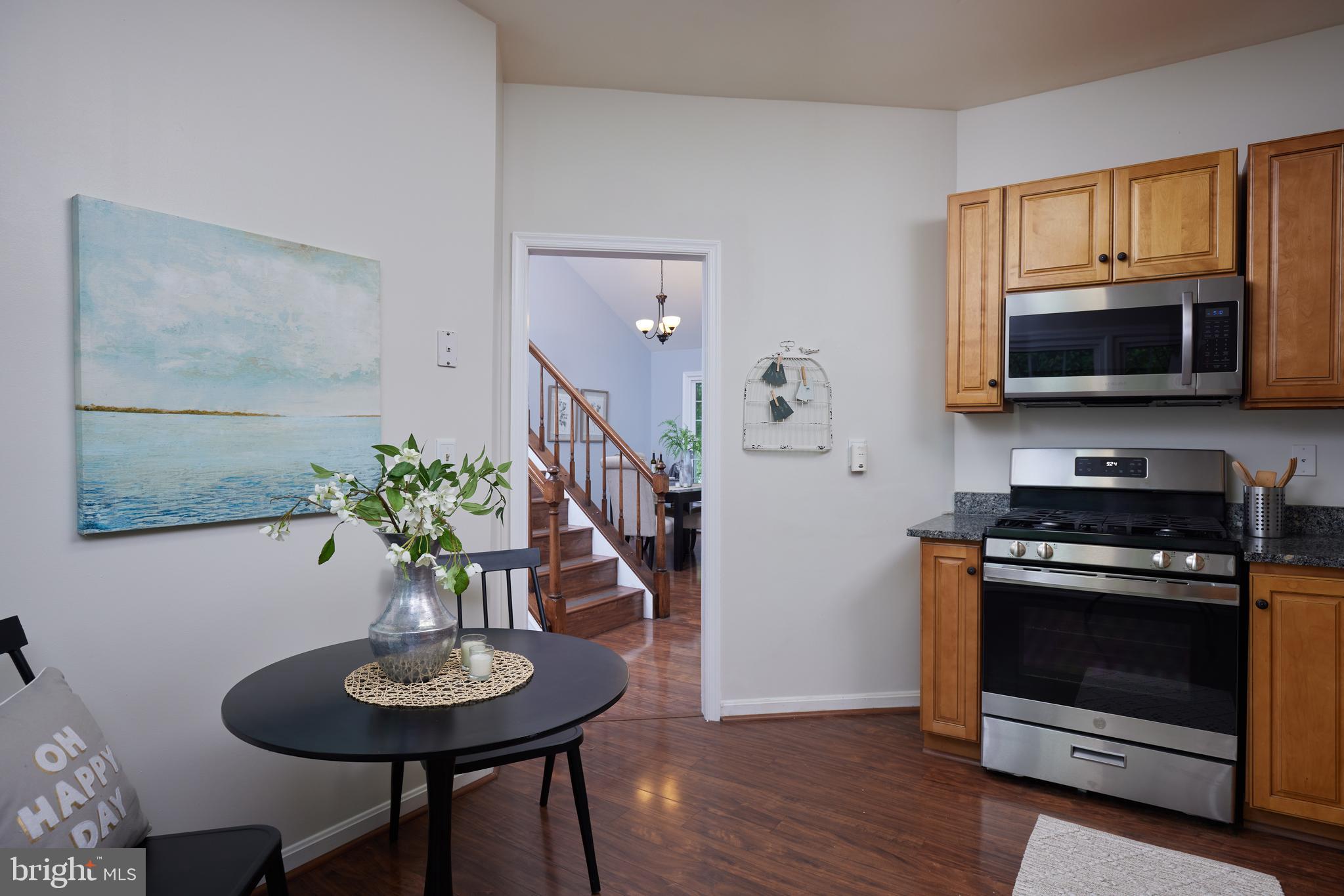 2723 Deer Ridge Drive Silver Spring, MD 20904 - Photo 14 of 45 a living room with furniture potted plant and kitchen view
