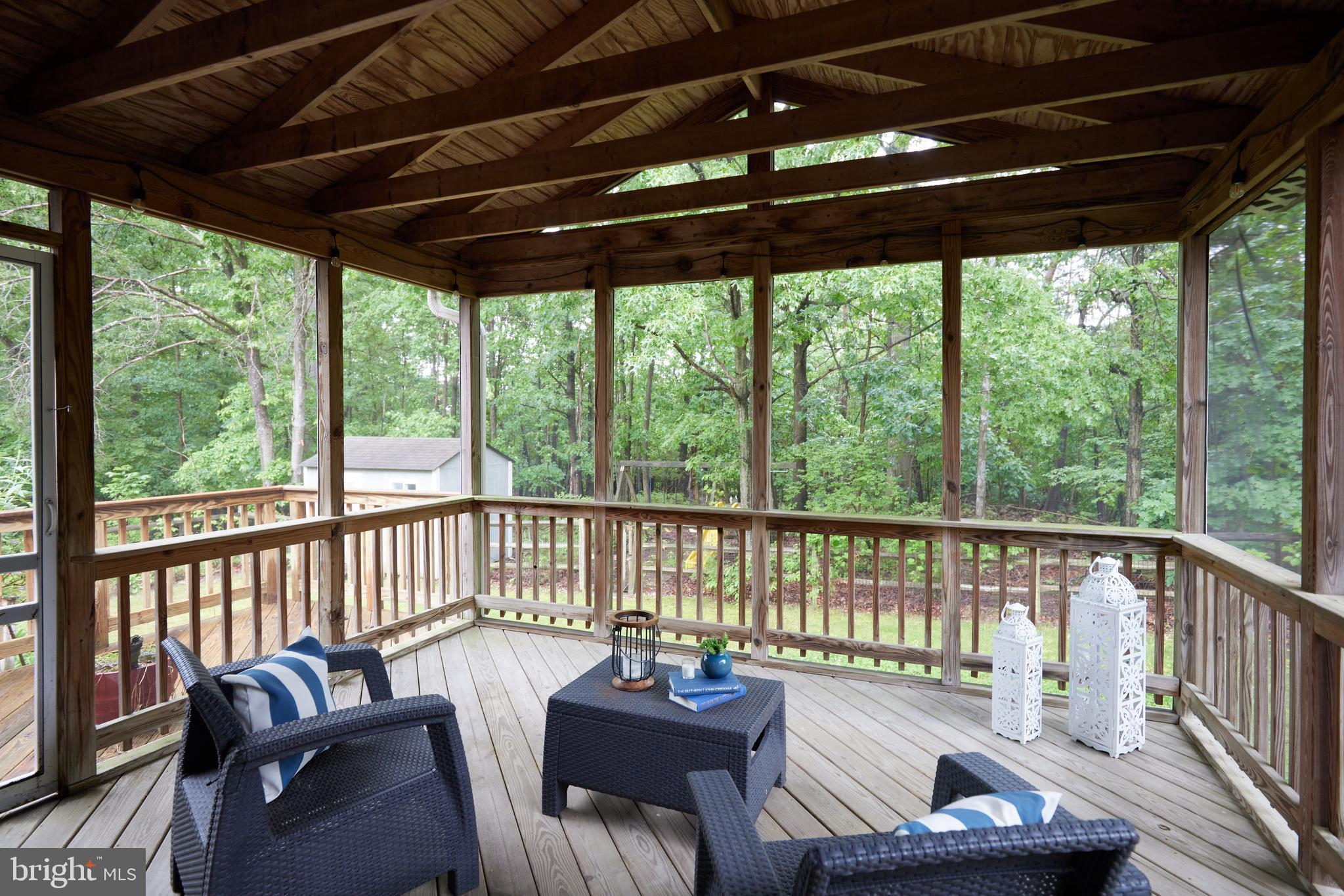 2723 Deer Ridge Drive Silver Spring, MD 20904 - Photo 16 of 45 a view of a chair and couch on the deck
