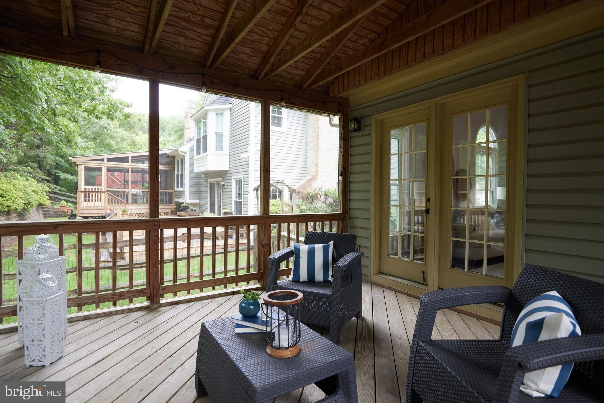 2723 Deer Ridge Drive Silver Spring, MD 20904 - Photo 18 of 45 a view of a patio with couches chairs and wooden floor