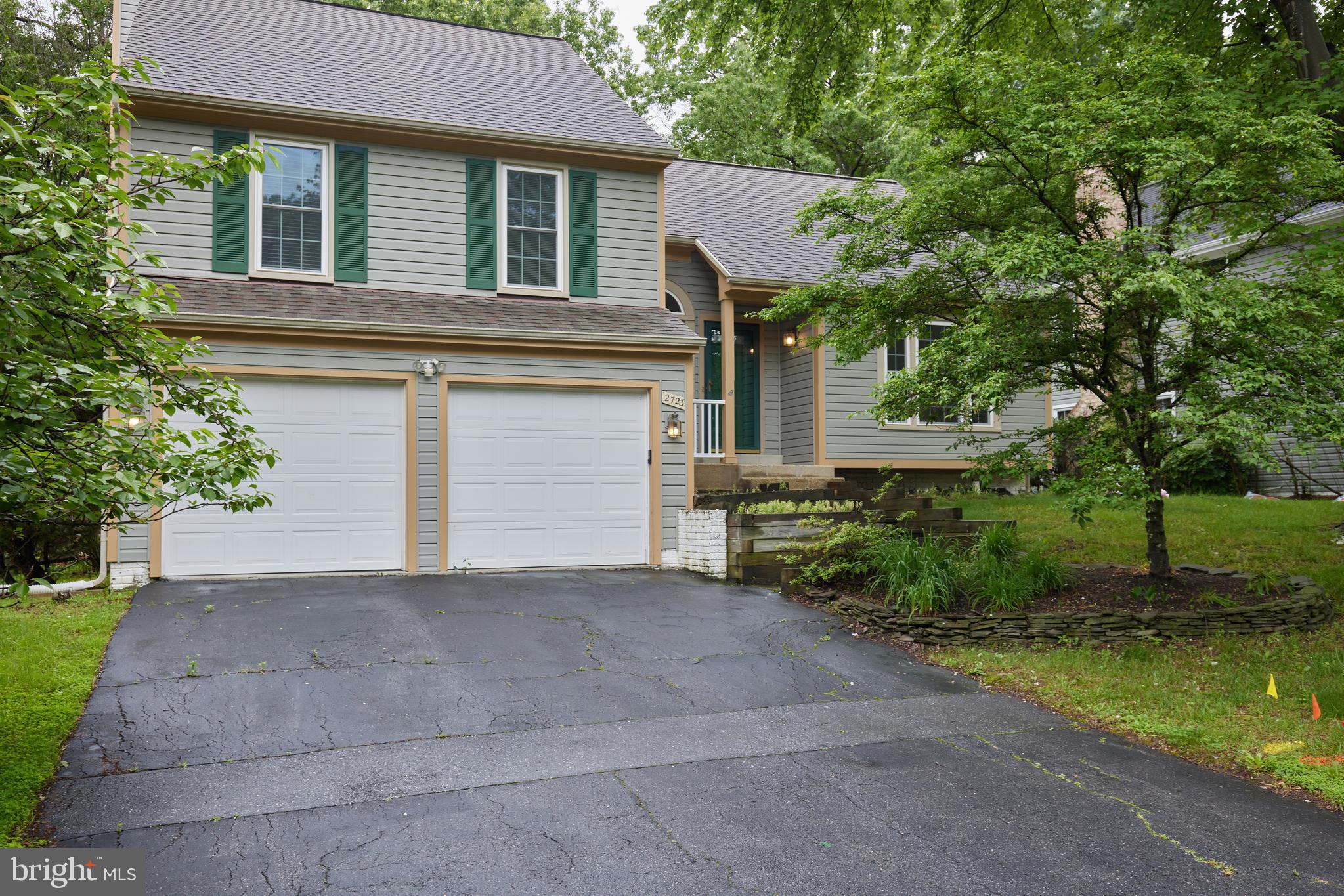 2723 Deer Ridge Drive Silver Spring, MD 20904 - Photo 2 of 45 a front view of a house with a yard and garage