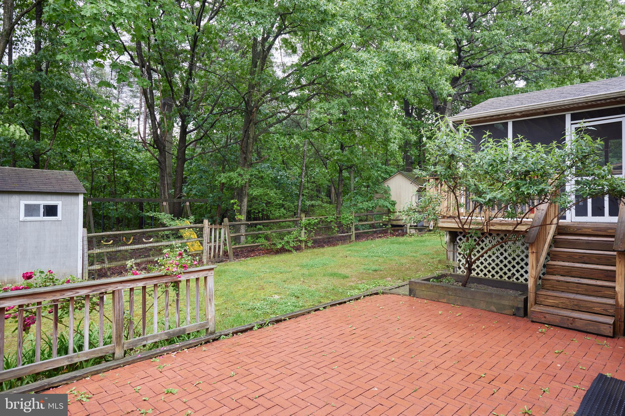 2723 Deer Ridge Drive Silver Spring, MD 20904 - Photo 21 of 45 a view of a deck with a table and chairs