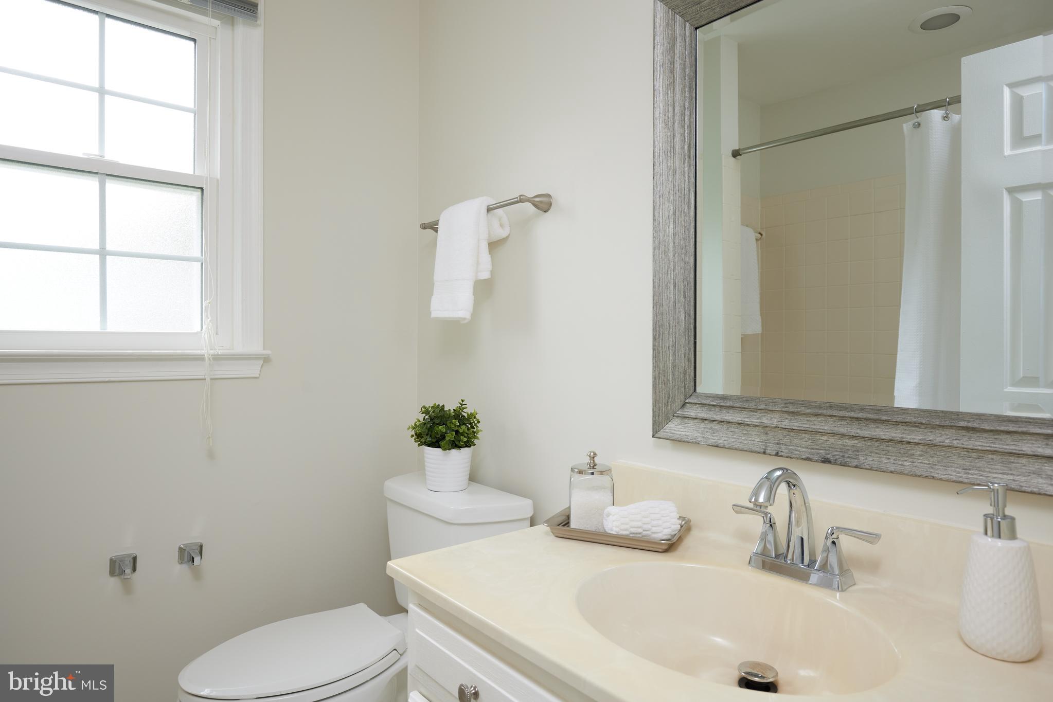 2723 Deer Ridge Drive Silver Spring, MD 20904 - Photo 27 of 45 a bathroom with a sink toilet and a mirror