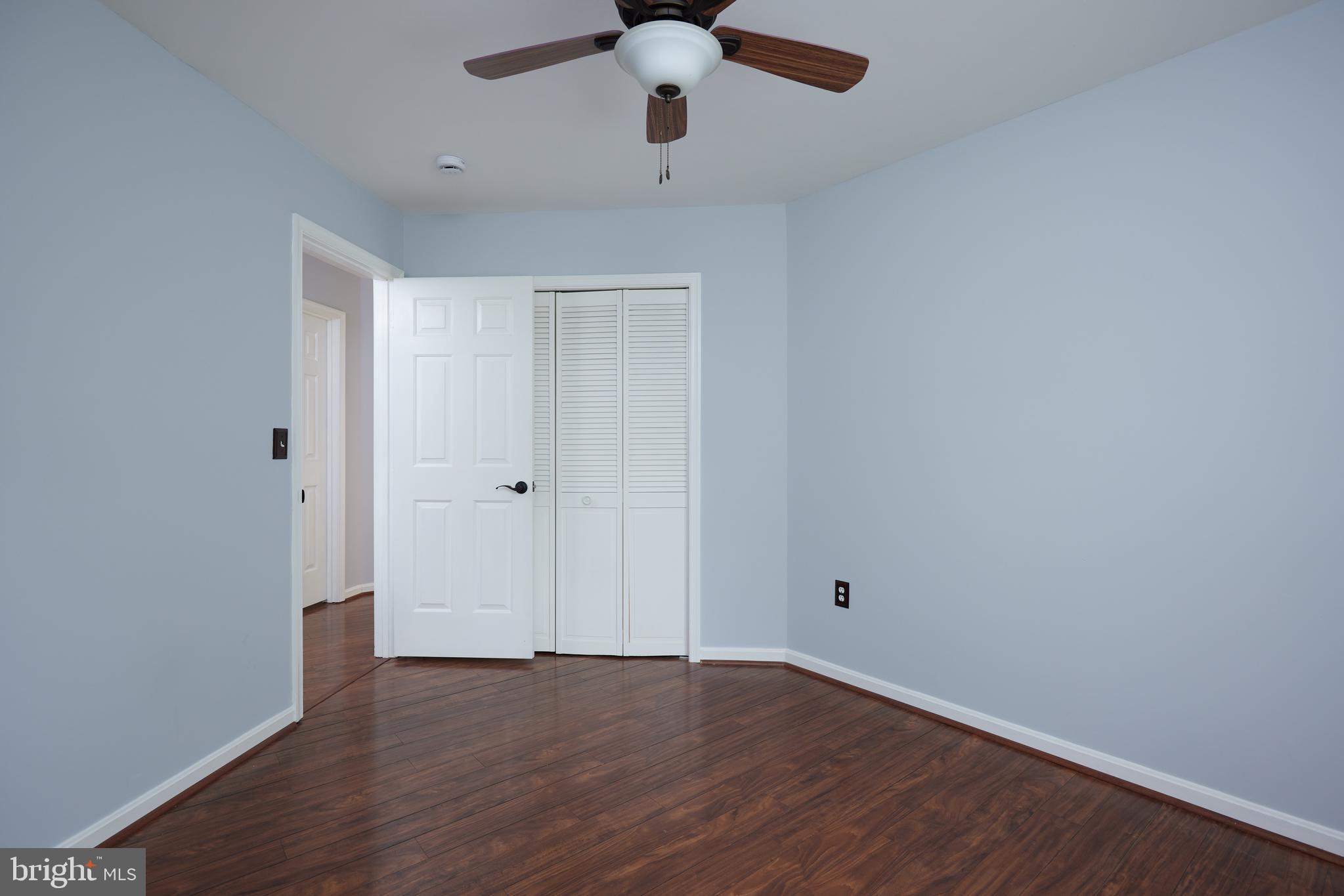 2723 Deer Ridge Drive Silver Spring, MD 20904 - Photo 29 of 45 a view of an empty room with wooden floor