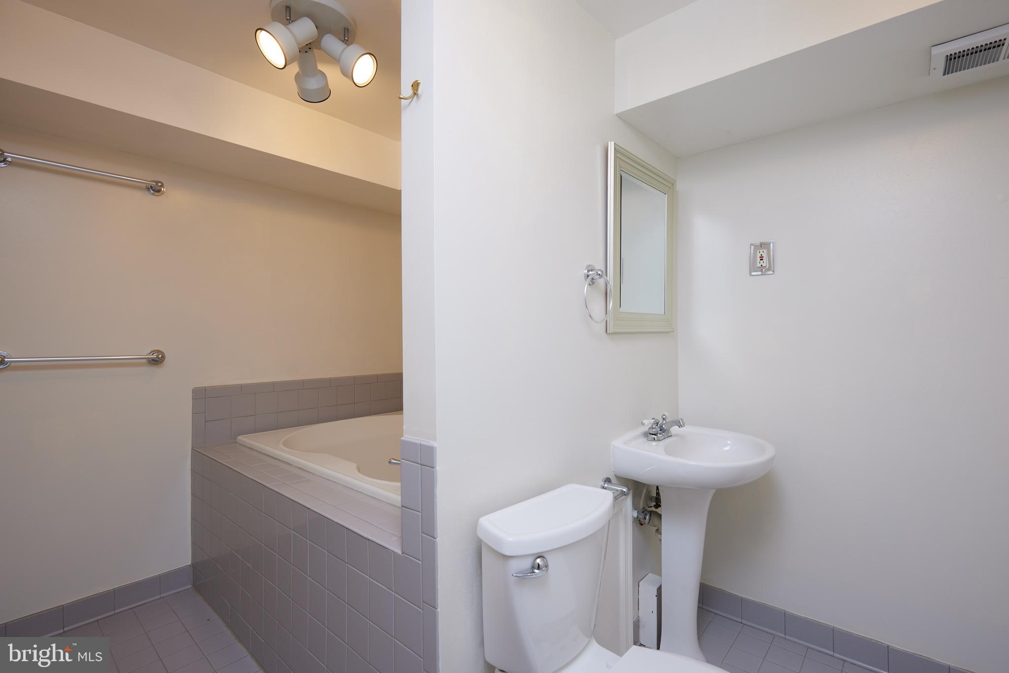 2723 Deer Ridge Drive Silver Spring, MD 20904 - Photo 40 of 45 a bathroom with a sink a toilet and shower