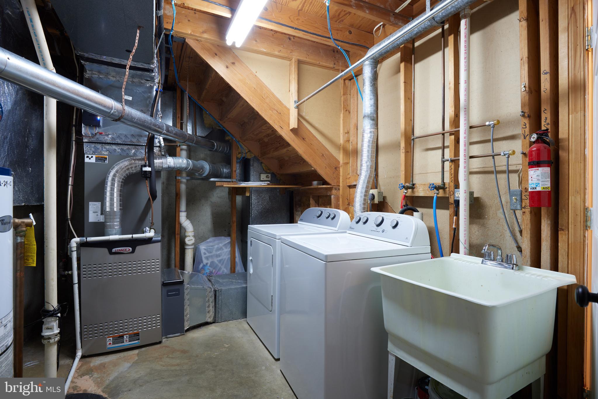 2723 Deer Ridge Drive Silver Spring, MD 20904 - Photo 42 of 45 a utility room with dryer and washer