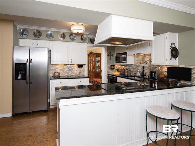 640 Spanish Main Spanish Fort, AL 36527 - Photo 10 of 33 Upgraded kitchen with newer appliances, granite counter tops, tile backsplash, under mount lighting.