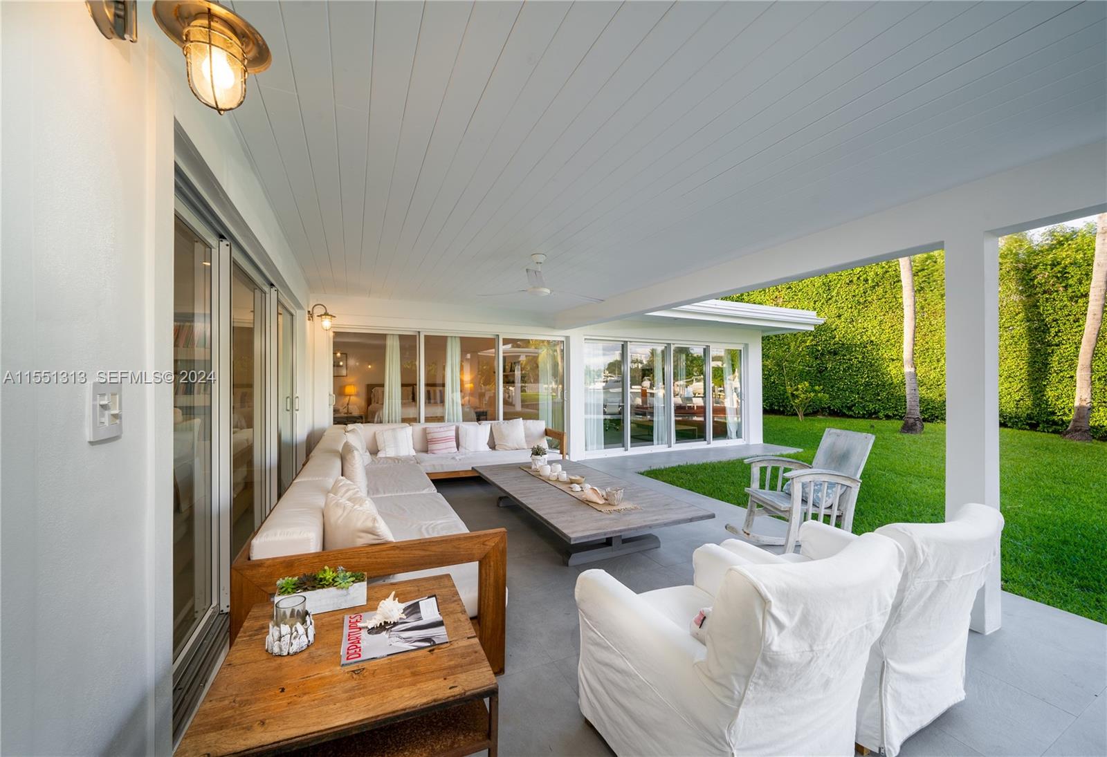 861 Harbor Drive Key Biscayne, FL 33149 - Photo 12 of 33 a living room with furniture and a large window