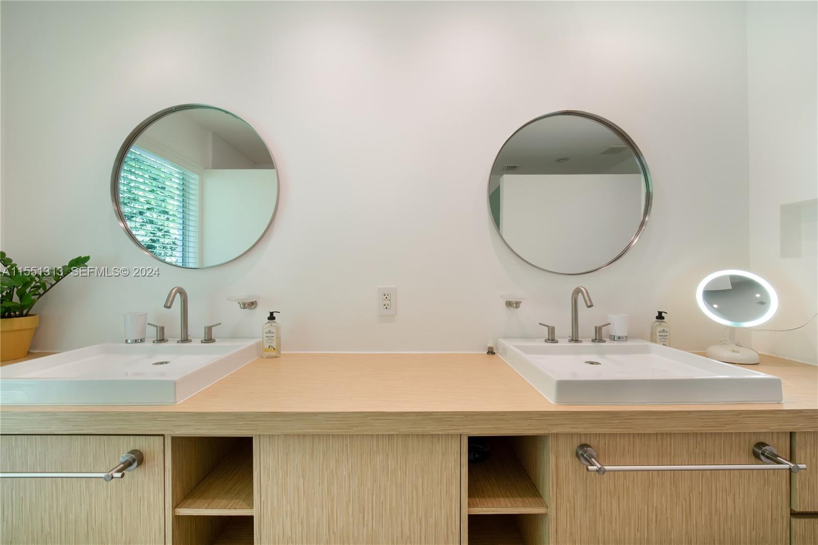 861 Harbor Drive Key Biscayne, FL 33149 - Photo 26 of 33 a bathroom with a sink and a mirror