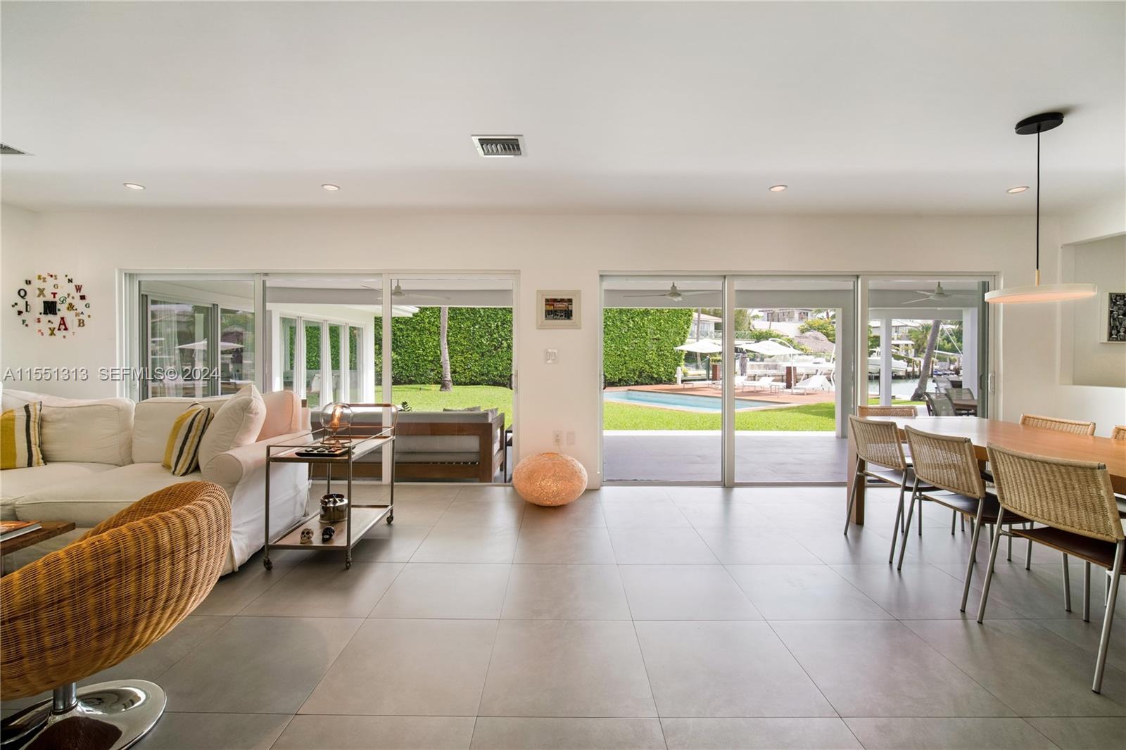 861 Harbor Drive Key Biscayne, FL 33149 - Photo 4 of 33 a living room with furniture and a floor to ceiling window