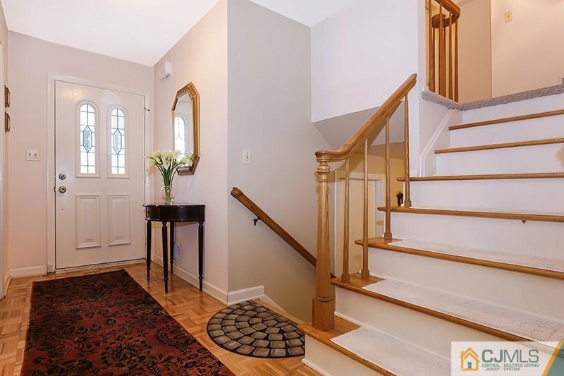 29 Nottingham Road Edison, NJ 08820 - Photo 2 of 18 a view of entryway with wooden floor and stairs