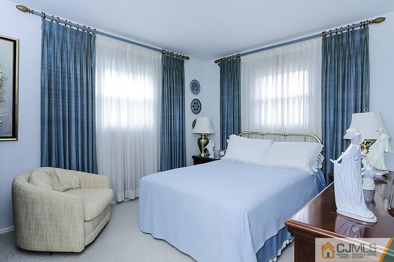 29 Nottingham Road Edison, NJ 08820 - Photo 12 of 18 a bedroom with a bed and a couch