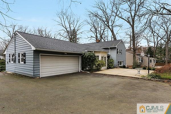 29 Nottingham Road Edison, NJ 08820 - Photo 15 of 18 a view of a house with a yard and garage