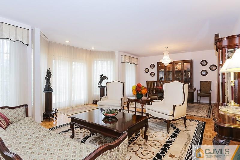 29 Nottingham Road Edison, NJ 08820 - Photo 5 of 18 a living room with furniture a rug and a table