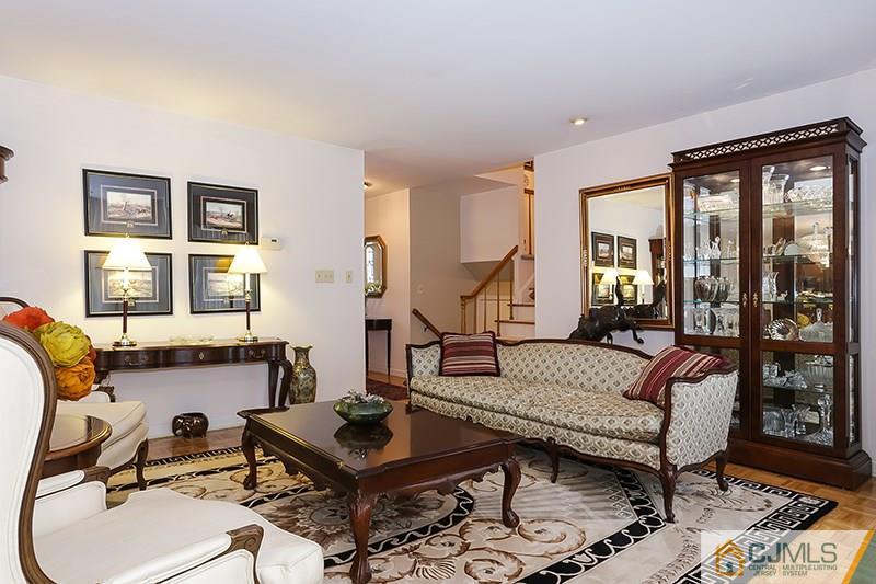 29 Nottingham Road Edison, NJ 08820 - Photo 6 of 18 a living room with furniture and two windows