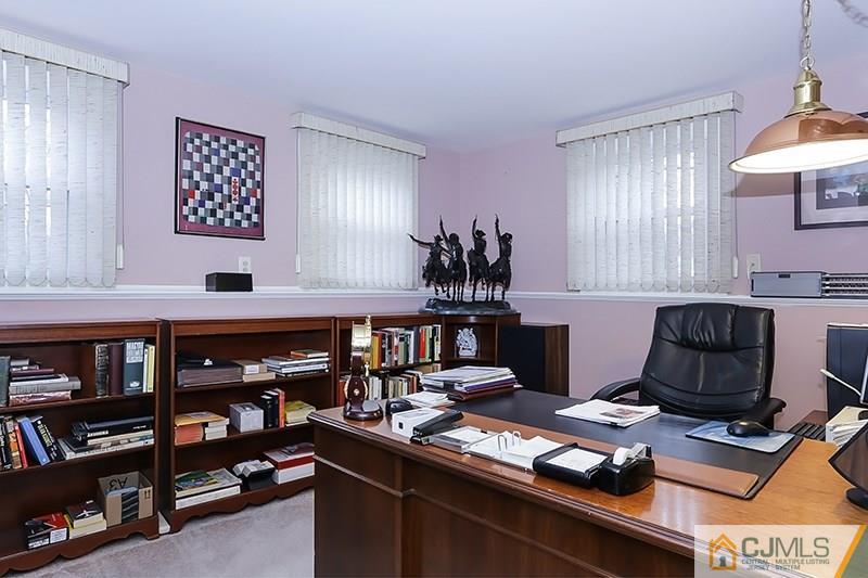29 Nottingham Road Edison, NJ 08820 - Photo 9 of 18 a room with furniture and a book shelf