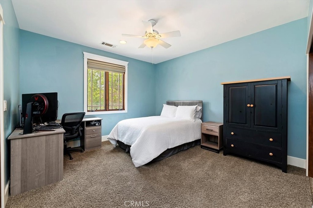 16420 Rocky Glen Road Perris, CA 92570 - Photo 33 of 74 a bedroom with a bed and a closet