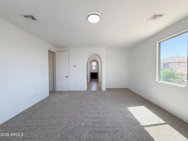 a view of a big room with windows and closet