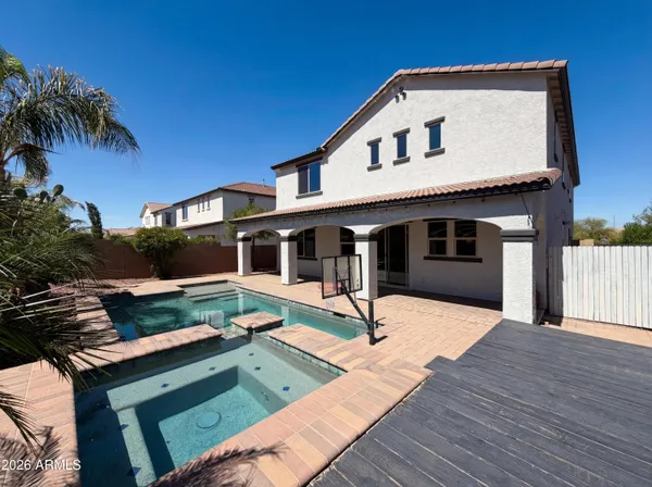 a front view of house with deck and outdoor seating