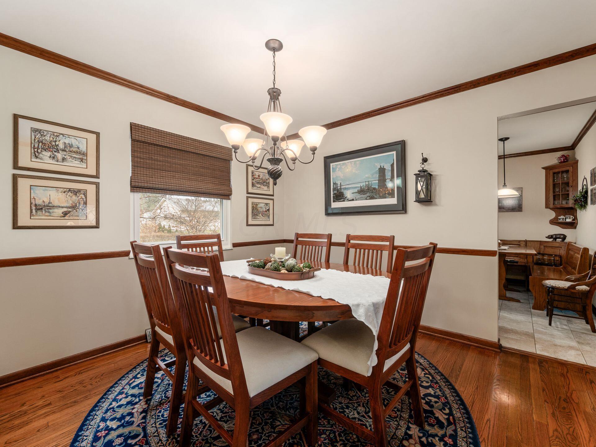 5577 Millington Road Columbus, OH 43235 - Photo 23 of 51 Dining Room - Crown Moldings, Wood Floors - 11'5" x 9'11"