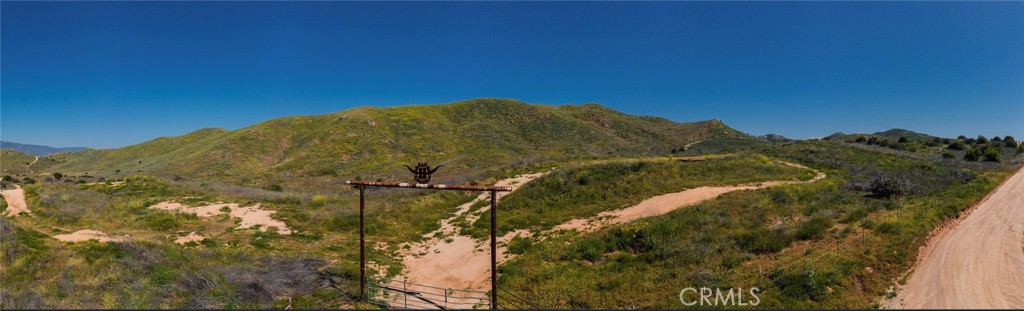 1 Dawson Canyon Road Perris, CA 92570 - Photo 1 of 7 a view of a house with a mountain and a forest