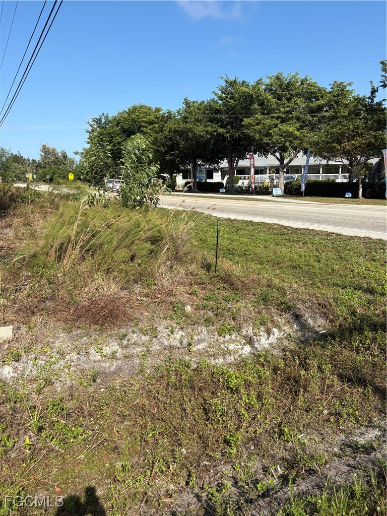 10641 Stringfellow Road Bokeelia, FL 33922 - Photo 4 of 4 a view of a yard with a house