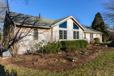 228 Huckins Neck Road Centerville, MA 02601 - Photo 1 of 19 a view of a house with a yard