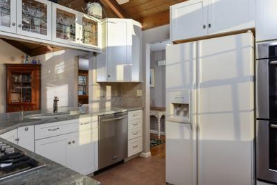 228 Huckins Neck Road Centerville, MA 02601 - Photo 11 of 19 a kitchen with a refrigerator and a sink