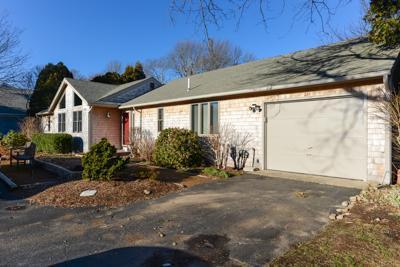 228 Huckins Neck Road Centerville, MA 02601 - Photo 2 of 19 a view of a house with a yard