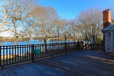 228 Huckins Neck Road Centerville, MA 02601 - Photo 3 of 19 a view of a deck with sunset view