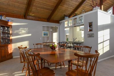 228 Huckins Neck Road Centerville, MA 02601 - Photo 7 of 19 a view of a dining room with furniture and window
