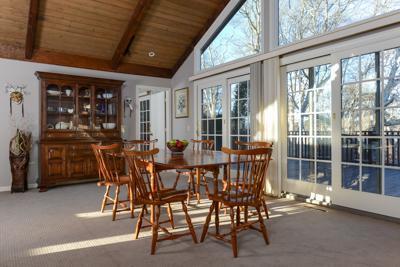 228 Huckins Neck Road Centerville, MA 02601 - Photo 8 of 19 a view of a dining room with furniture window and outside view